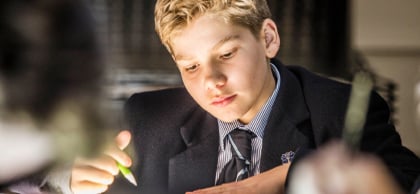 Melbourne Grammar School boy in class