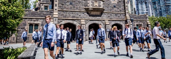 Melbourne Grammar School boys outside bluestone building