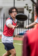 Melbourne Grammar School boys playing with frisbee