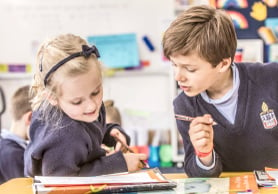 Melbourne Grammar School boy and girl learning together