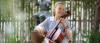 Girl playing cello in garden